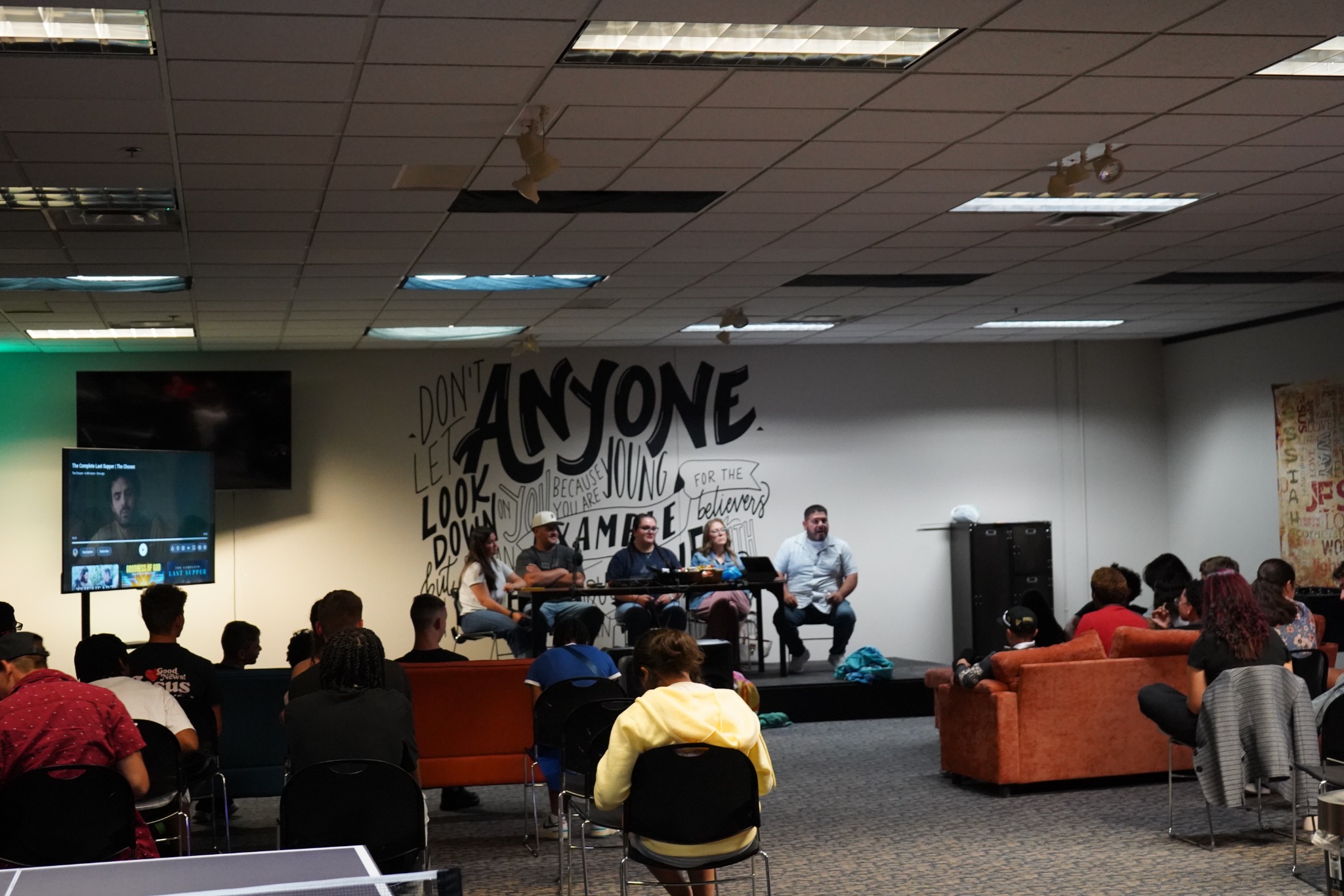Youth gathered for a panel discussion in the Bethesda youth room.