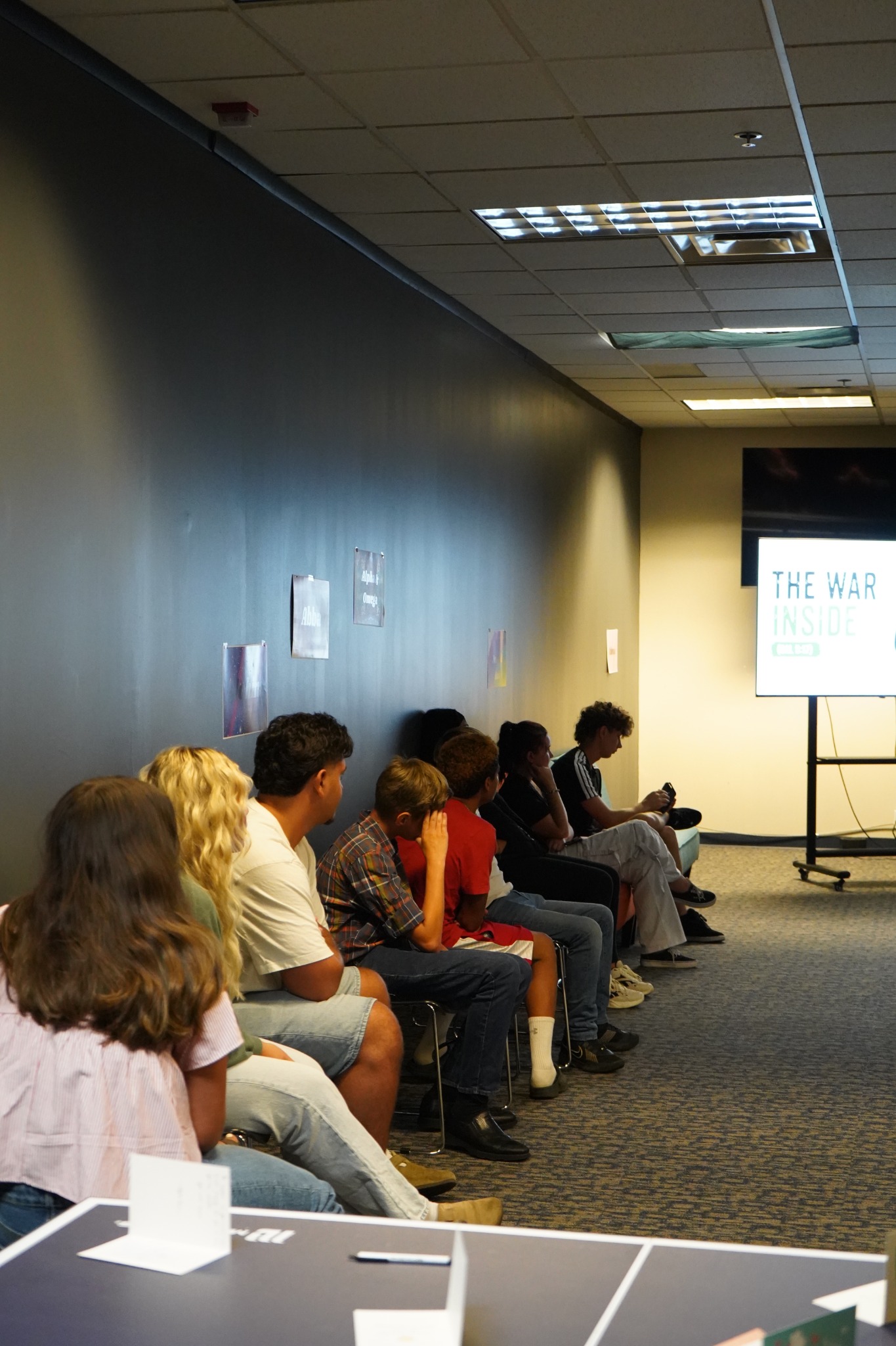 Young people seated together during a youth gathering.